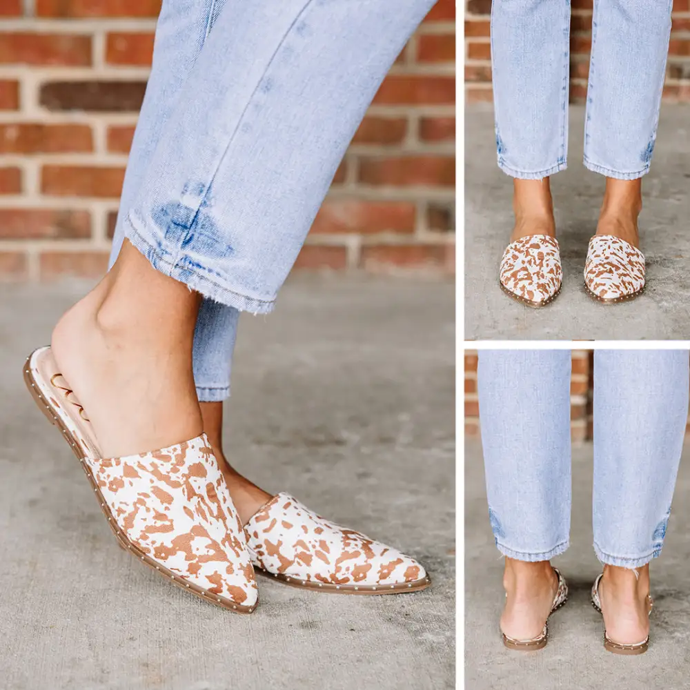 On Good Terms Tan Brown Cow Print Mules