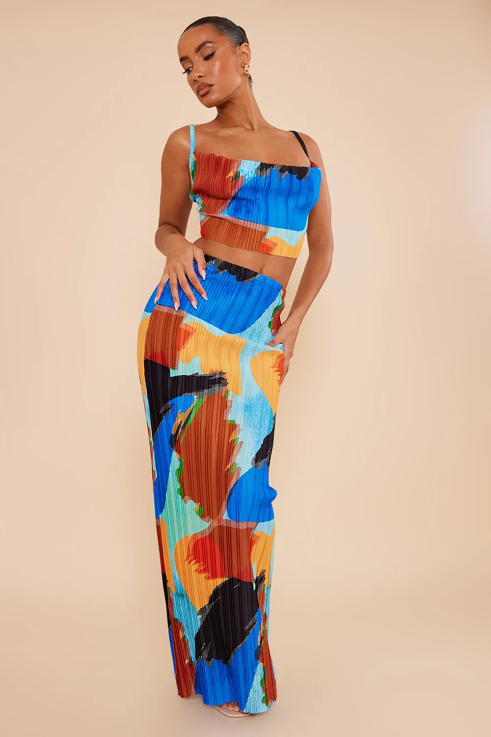 blue abstract print plisse strappy cowl neck top and skirt set