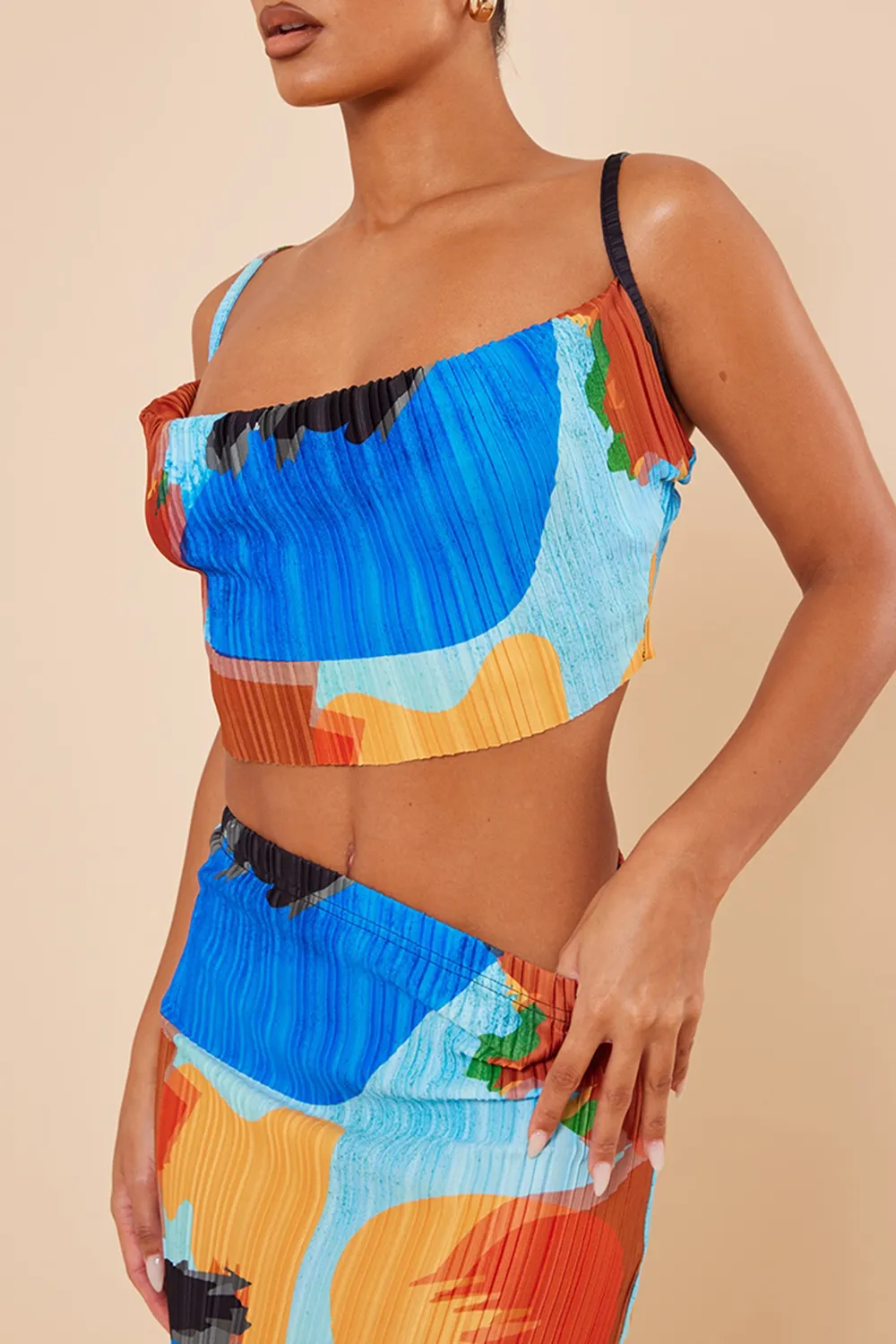 blue abstract print plisse strappy cowl neck top and skirt set
