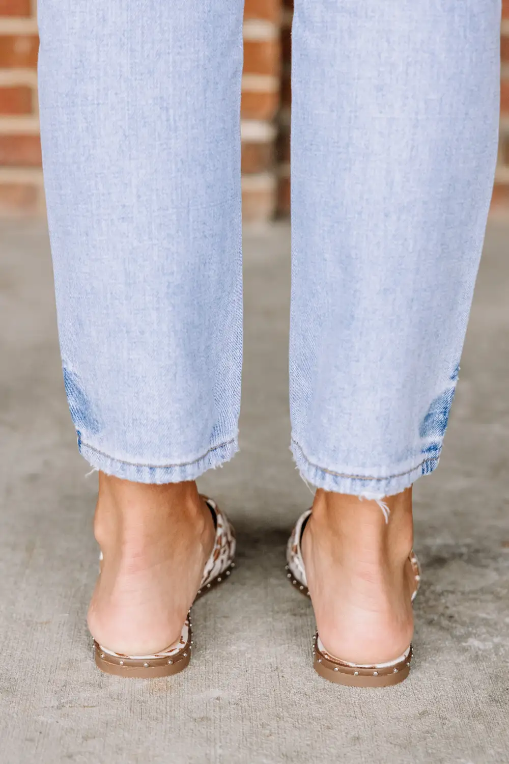 On Good Terms Tan Brown Cow Print Mules