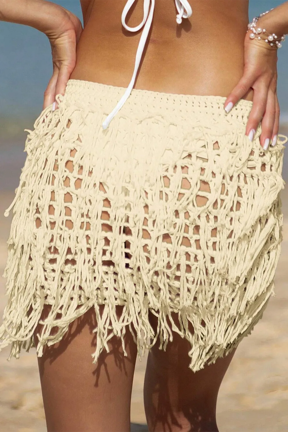 Crocheted beach cover-up skirt with cutout fringe hem