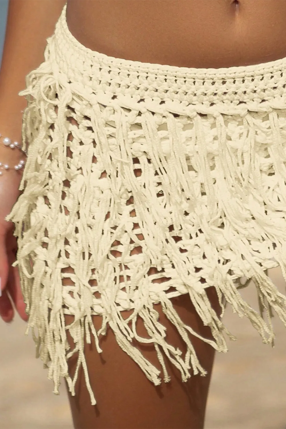 Crocheted beach cover-up skirt with cutout fringe hem