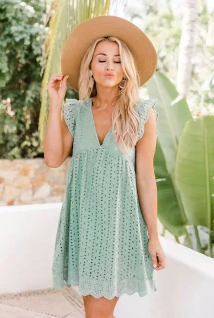 European and American women's new lace jacquard hollow V-neck dress women have pocket cloth shorts.